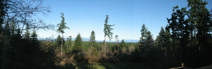 Panoramic view of sunshine coast across the strait